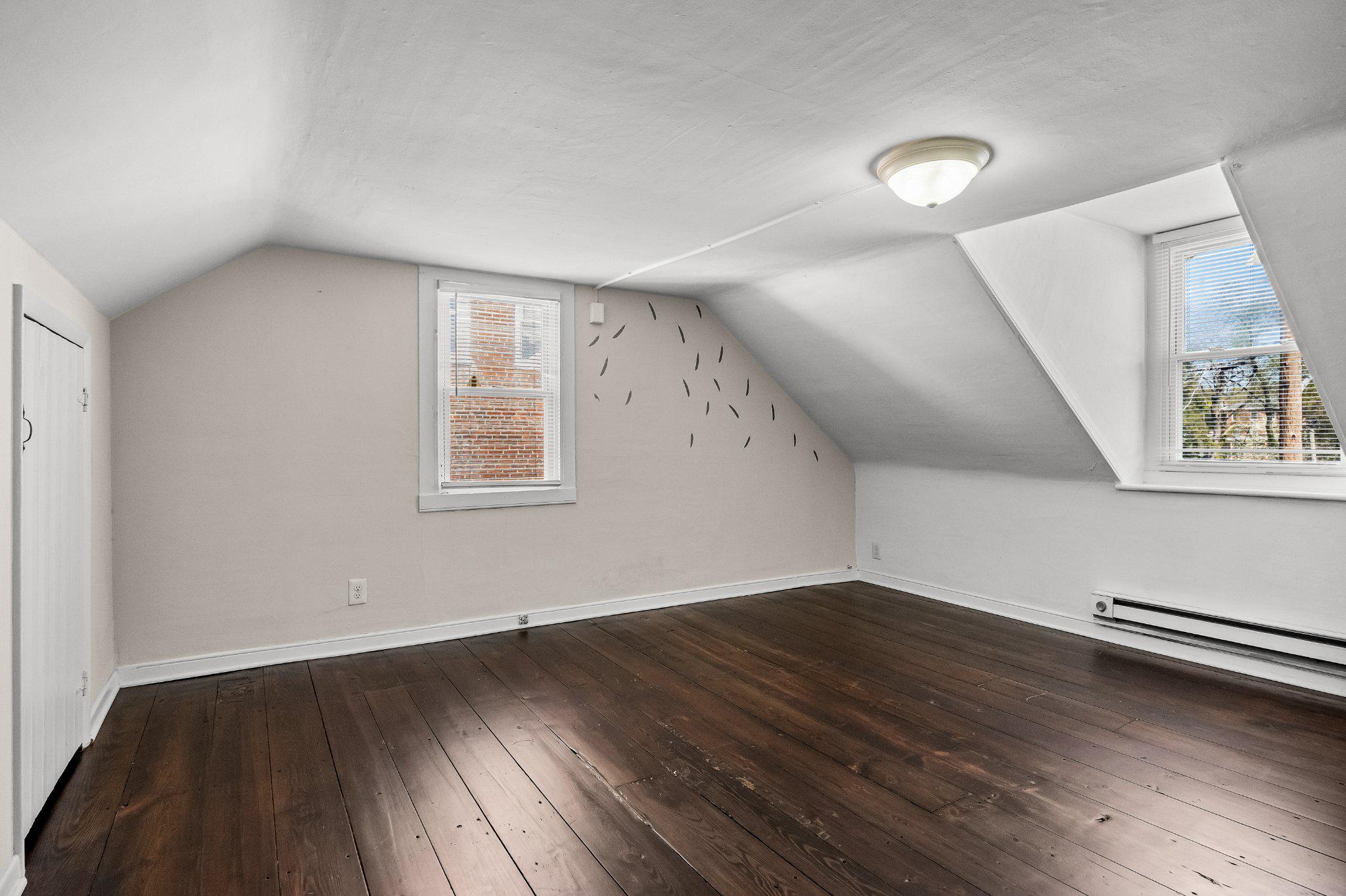 36 Brainerd Street Mount Holly, NJ 08060 - Photo 18 of 28 an empty room with wooden floor and windows