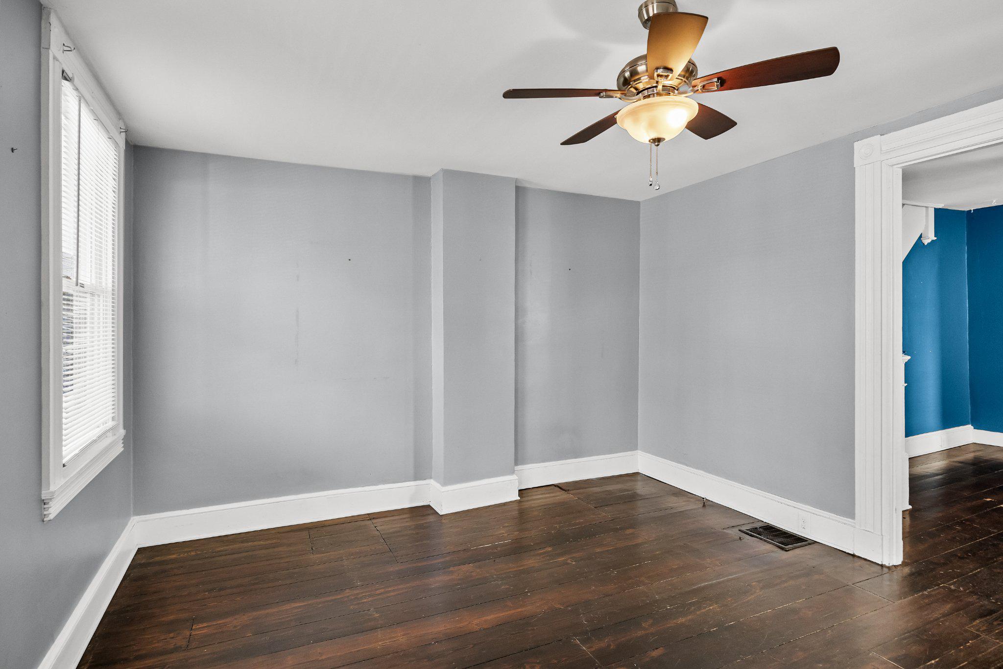 36 Brainerd Street Mount Holly, NJ 08060 - Photo 4 of 28 a view of an empty room with window and wooden floor