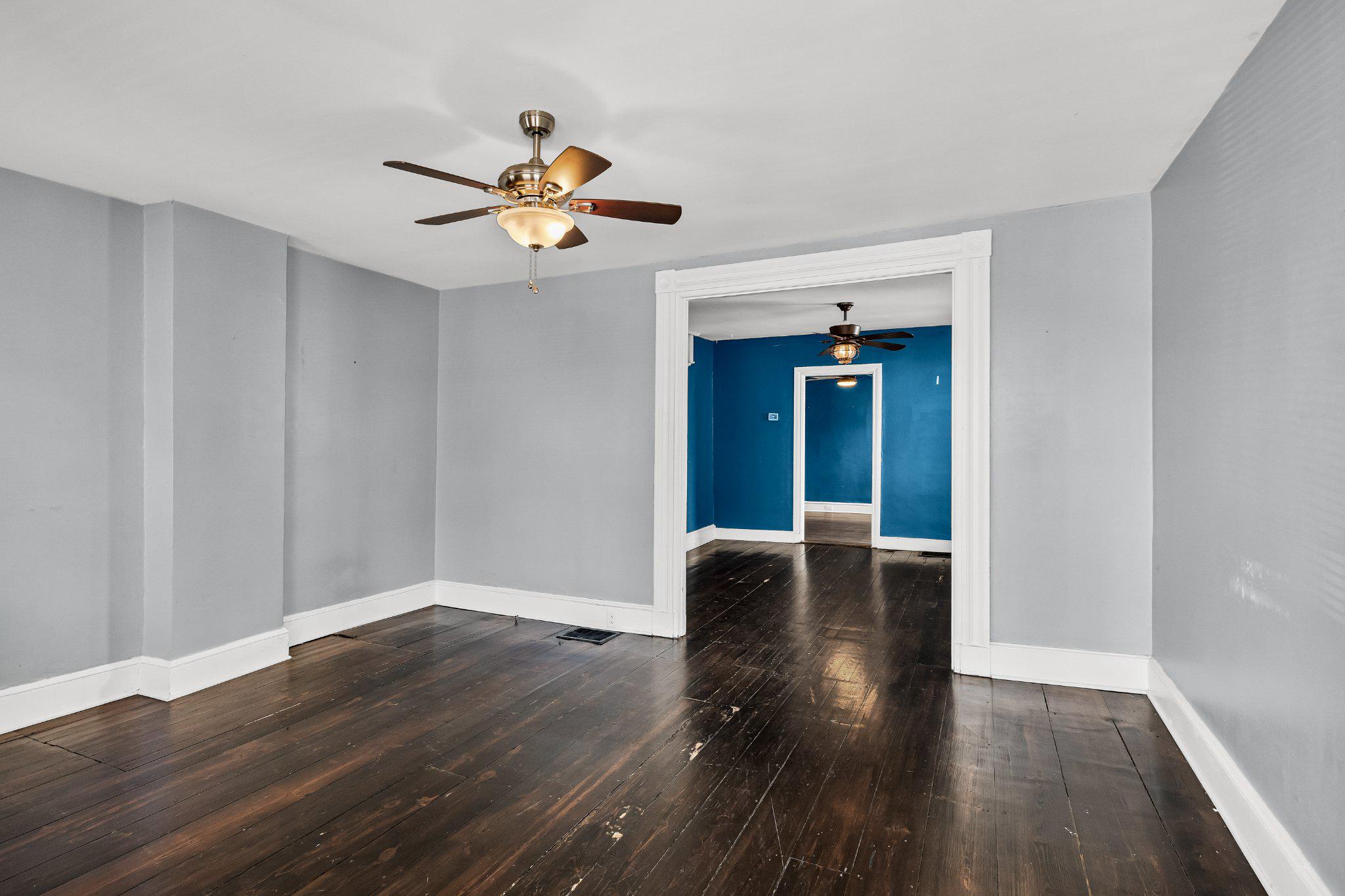 36 Brainerd Street Mount Holly, NJ 08060 - Photo 5 of 28 a view of an empty room with wooden floor and a ceiling fan