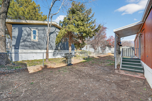 269 Mindella Way, Unit A Layton, UT 84041 - Photo 24 of 37 Fenced yard featuring a storage shed