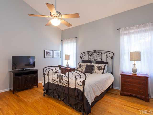2337 Florida Court Raleigh, NC 27615 - Photo 14 of 25 The first floor master retreat offers a cathedral ceiling. large walk-in closet and a ceiling fan. The homeowner also added the beautiful site-finished hardwood floors.
