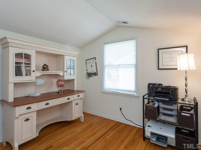2337 Florida Court Raleigh, NC 27615 - Photo 18 of 25 Bedroom #3 is currently being used as a home office. It features recently installed site-finished hardwood floors, cathedral ceiling, and a double door closet.
