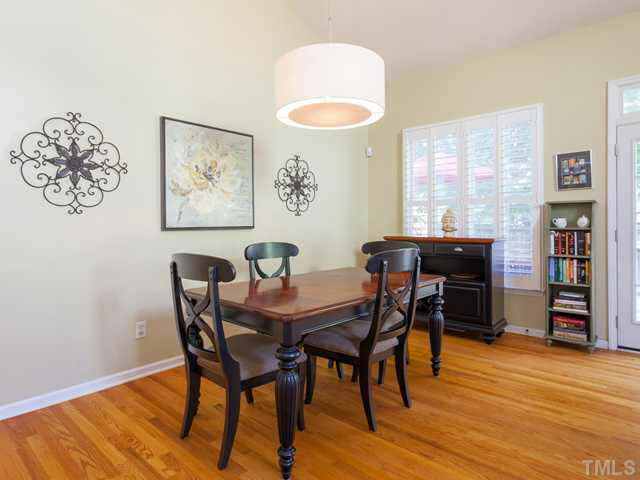 2337 Florida Court Raleigh, NC 27615 - Photo 8 of 25 The dining room is open to the kitchen and features hardwood floors and plantation shutters.