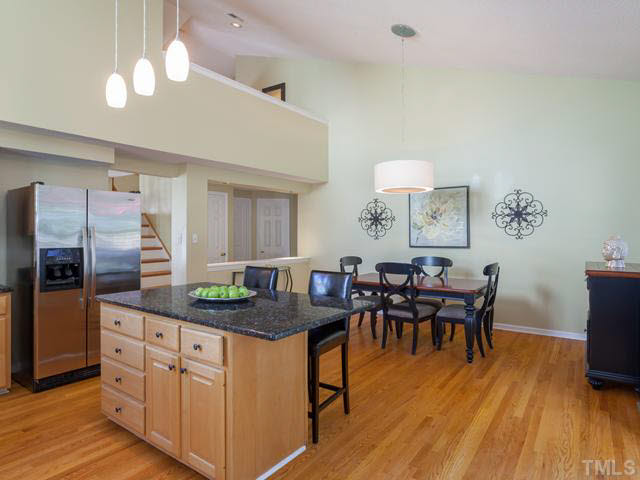 2337 Florida Court Raleigh, NC 27615 - Photo 10 of 25 New upscale lighting has been installed over the kitchen island and the dining room.