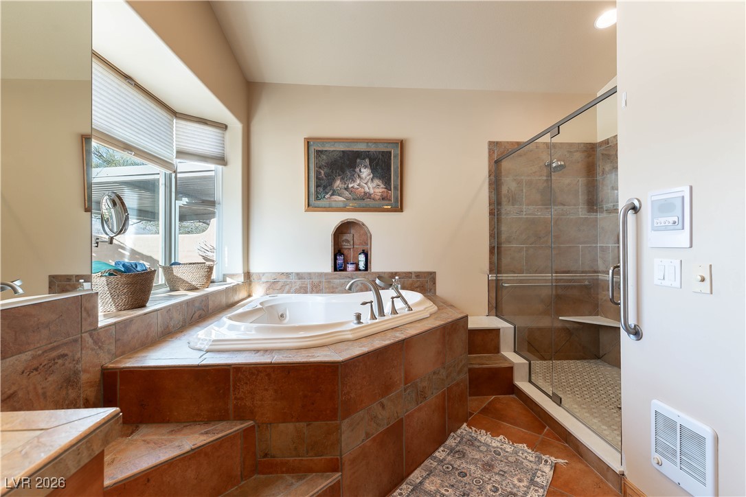 13675 Racel Street Las Vegas, NV 89166 - Photo 27 of 55 Full bathroom with a shower stall, a bath, heating unit, and dark tile patterned flooring