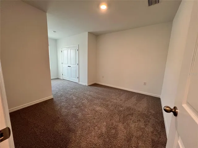 an empty room with an entryway