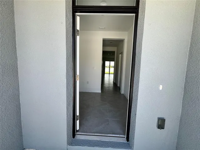 a view of a bathroom from a hallway