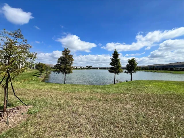 a view of a swimming pool with seating space
