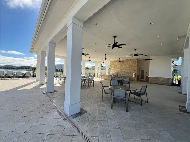 a view of a house with a yard porch and sitting area