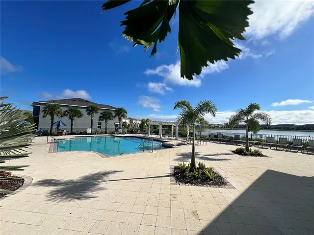 a house view with a sitting space fire pit and outdoor space