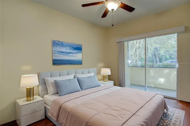 a bedroom with a large bed and a window