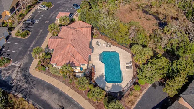 an aerial view of a house with outdoor space