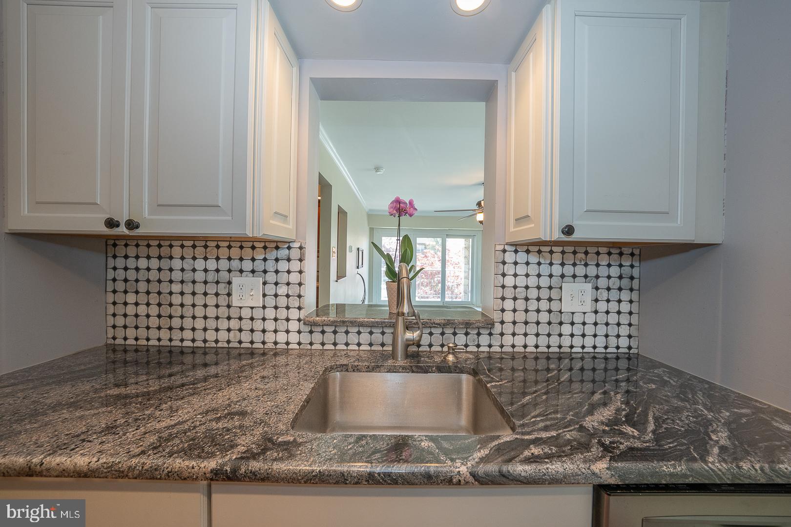 441 Drummers Lane, Unit 441 Wayne, PA 19087 - Photo 16 of 32 a bathroom with a granite countertop sink