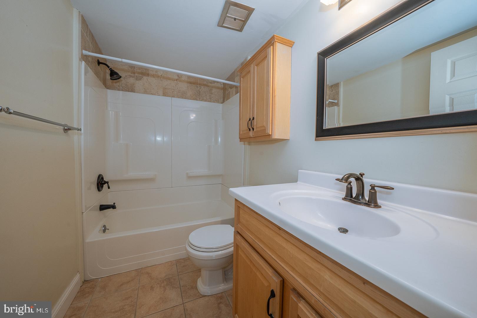 441 Drummers Lane, Unit 441 Wayne, PA 19087 - Photo 23 of 32 a bathroom with a sink a toilet and shower