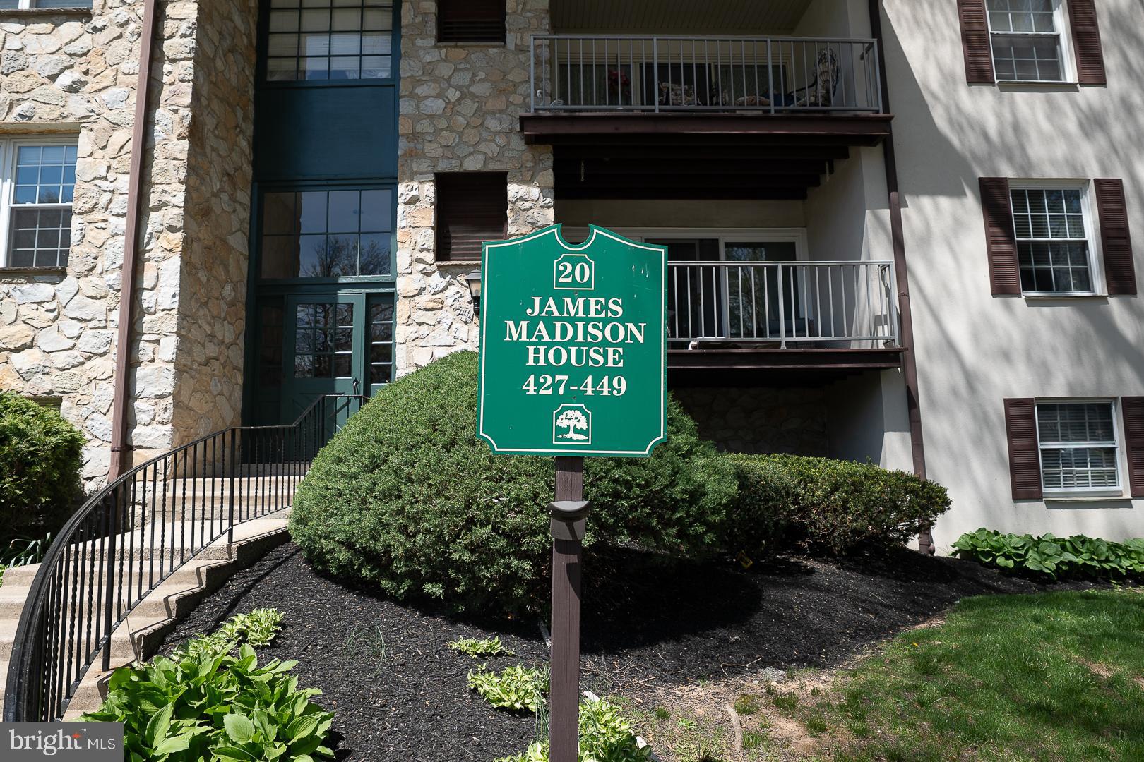 441 Drummers Lane, Unit 441 Wayne, PA 19087 - Photo 4 of 32 a front view of a house with a yard