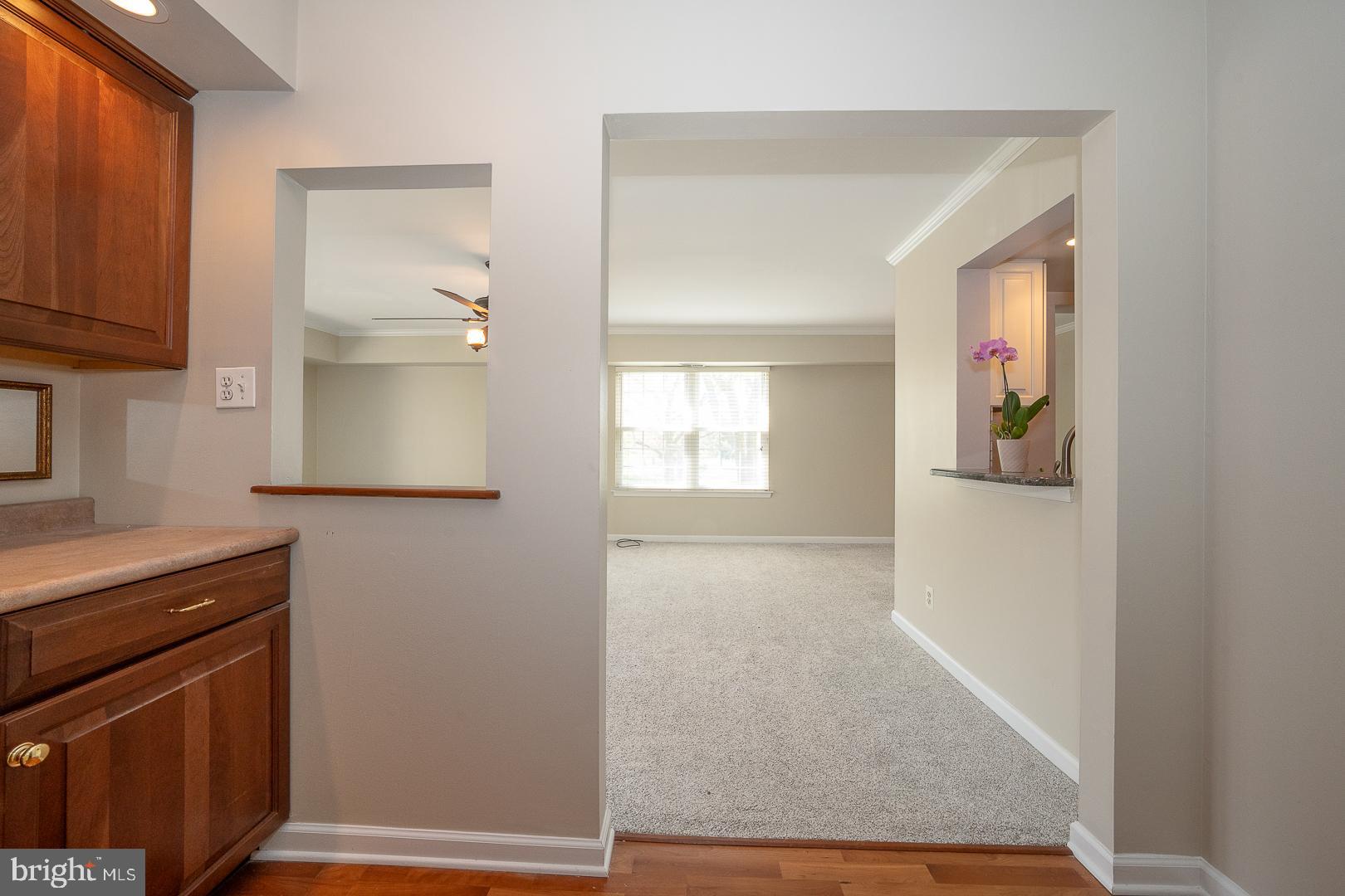 441 Drummers Lane, Unit 441 Wayne, PA 19087 - Photo 8 of 32 a hallway with cabinet and wooden floor