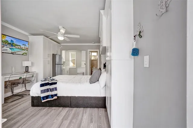 a kitchen with stainless steel appliances a refrigerator and a stove