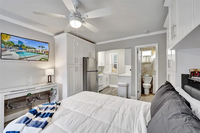 a bed room with a bed and a television