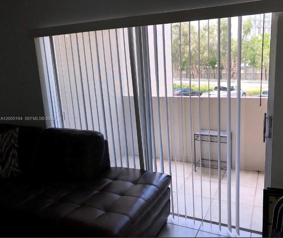 7705 Southwest 86th Street, Unit B211 Miami, FL 33143 - Photo 12 of 22 a living room filled with furniture