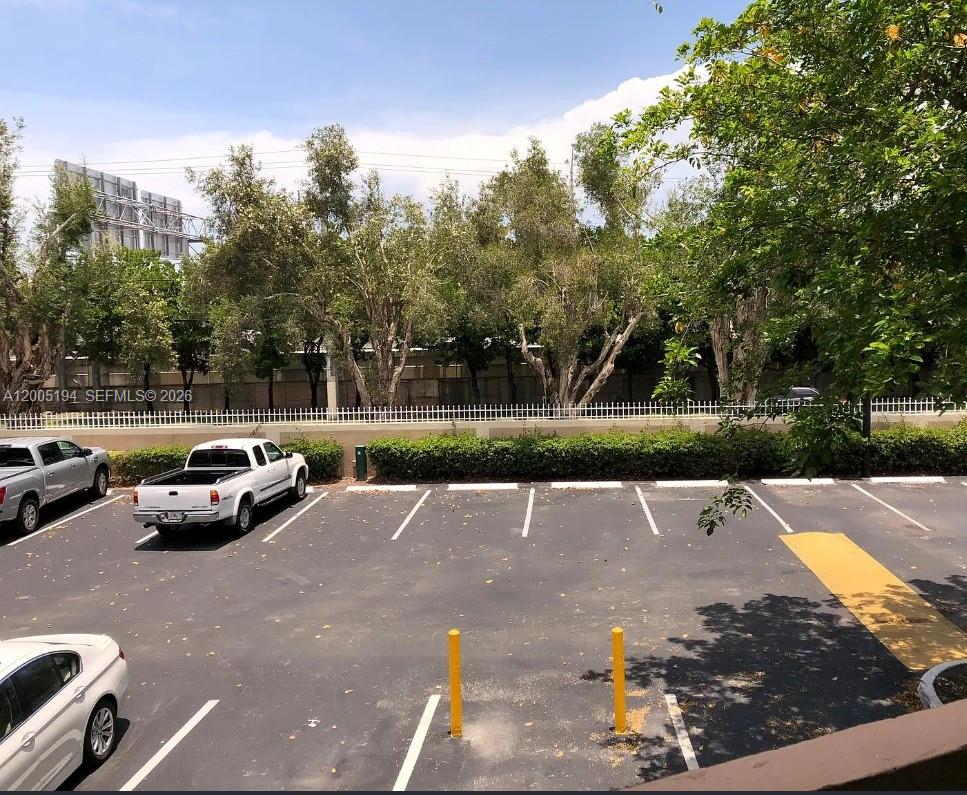 7705 Southwest 86th Street, Unit B211 Miami, FL 33143 - Photo 17 of 22 a view of street with parked cars