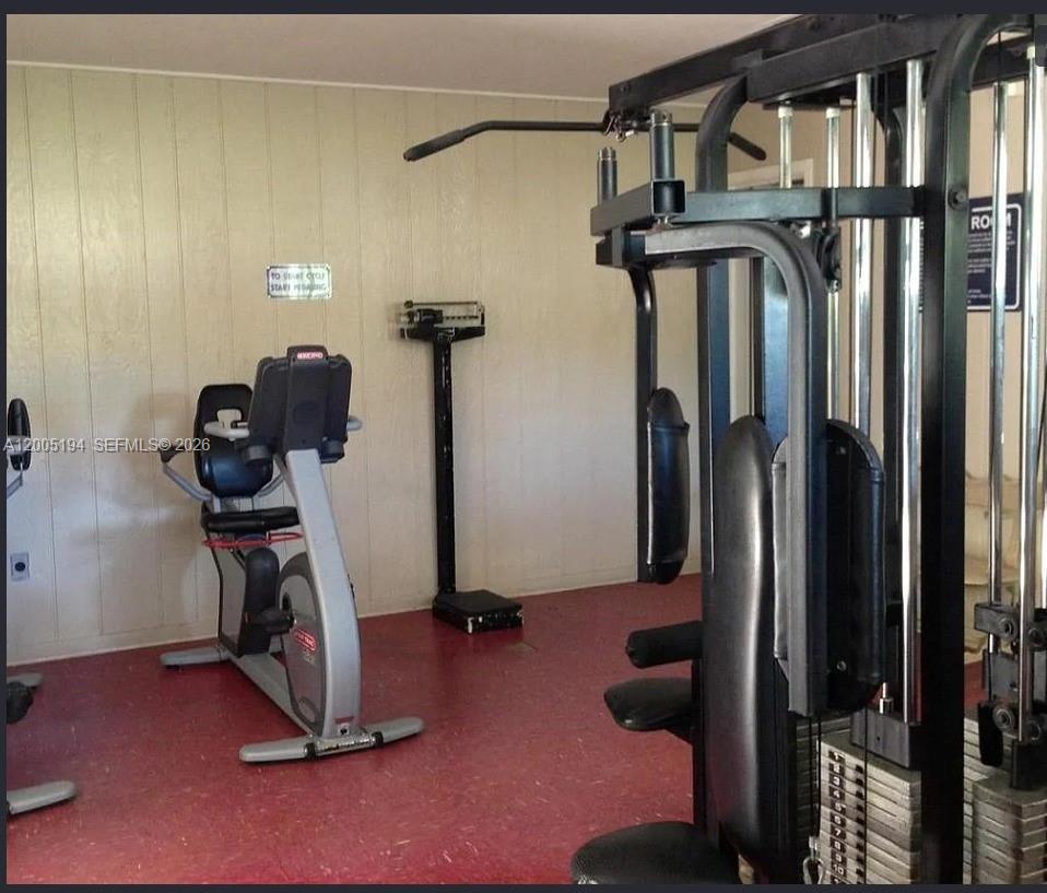 7705 Southwest 86th Street, Unit B211 Miami, FL 33143 - Photo 18 of 22 a view of gym equipment