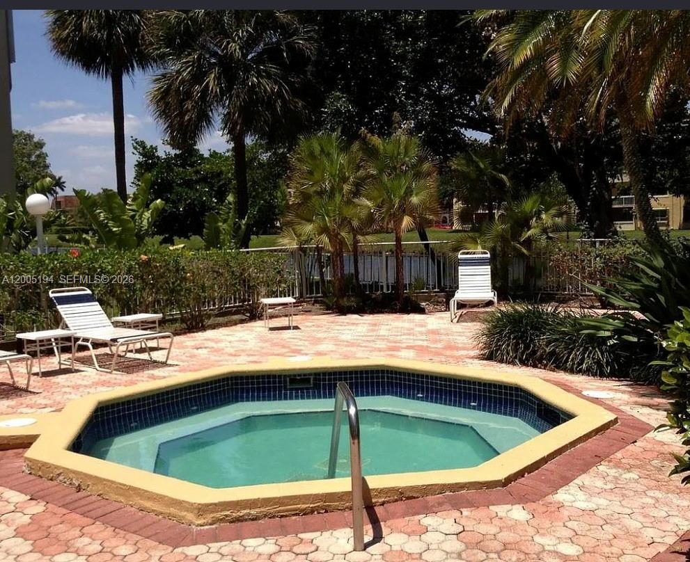 7705 Southwest 86th Street, Unit B211 Miami, FL 33143 - Photo 20 of 22 a view of swimming pool with chairs
