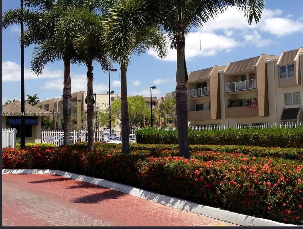 7705 Southwest 86th Street, Unit B211 Miami, FL 33143 - Photo 21 of 22 a view of a street with a building in the background