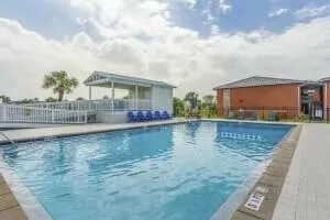 a view of a swimming pool with an outdoor seating
