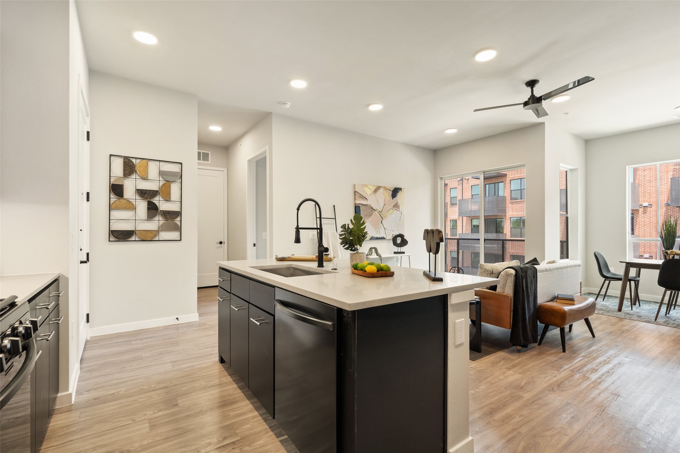 4510 Terry-O Lane, Unit 341 Austin, TX 78745 - Photo 11 of 40 The open-concept living area features light wood-look flooring and recessed lighting