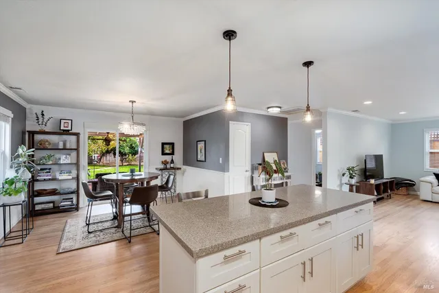 a kitchen with a table and chairs in it