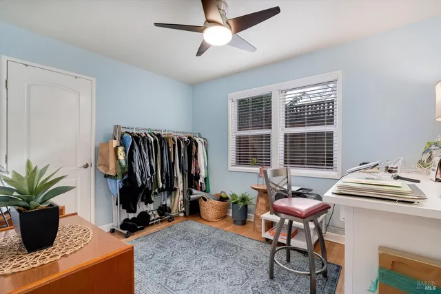 a bedroom with furniture and a window