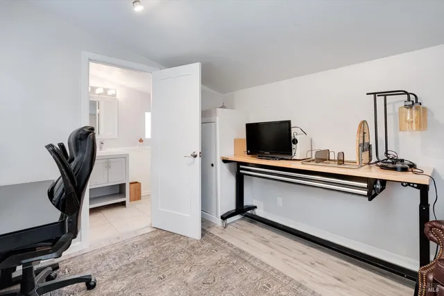 a view of workspace and living room