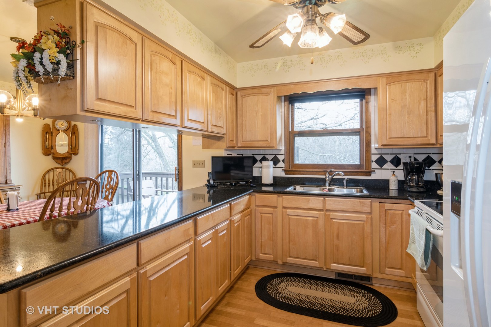 1N400 Pouley Road Elburn, IL 60119 - Photo 11 of 50 a kitchen with stainless steel appliances a sink a stove a window cabinets and a dining table