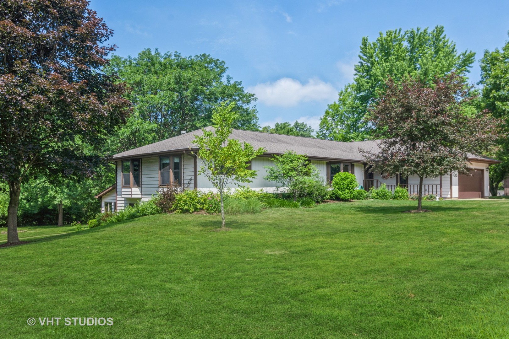 1N400 Pouley Road Elburn, IL 60119 - Photo 4 of 50 a view of a house next to a big yard and large trees