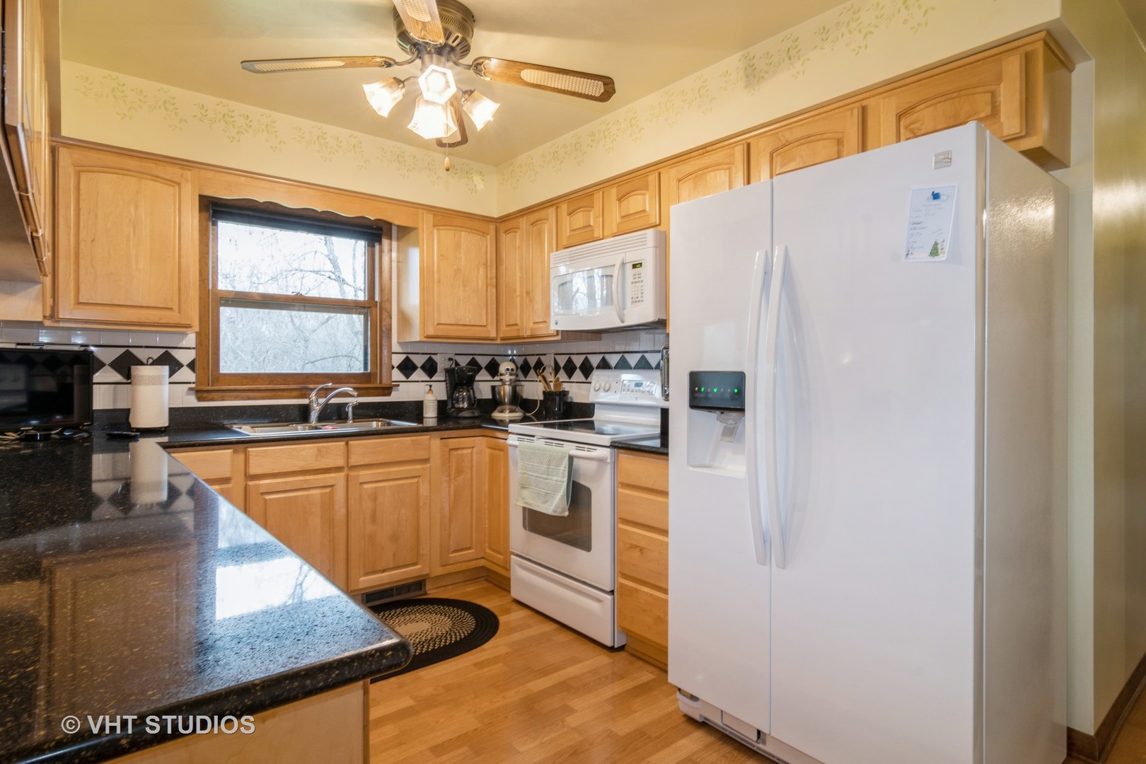 1N400 Pouley Road Elburn, IL 60119 - Photo 9 of 50 a kitchen with stainless steel appliances granite countertop a refrigerator a sink dishwasher a stove and white cabinets with wooden floor