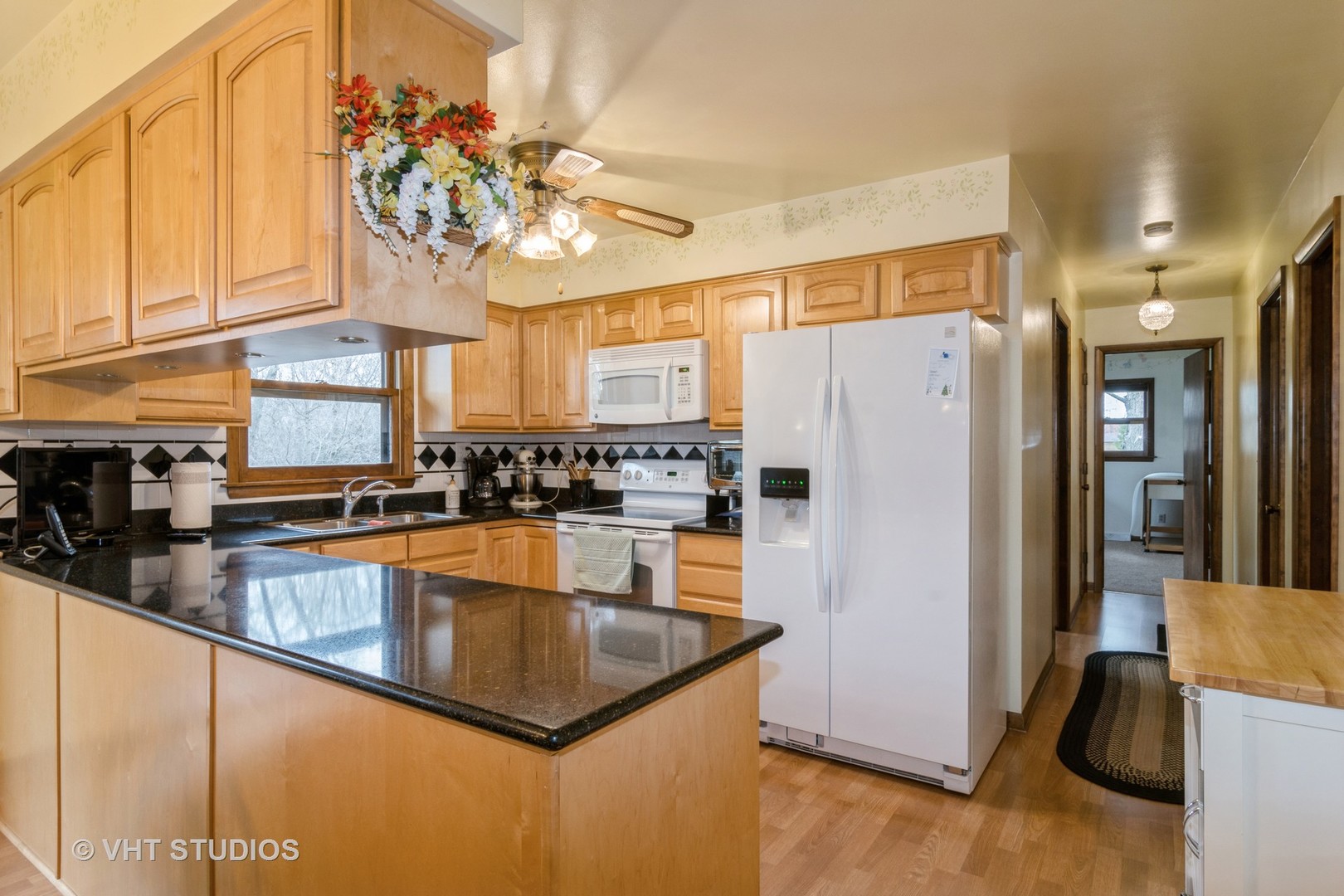 1N400 Pouley Road Elburn, IL 60119 - Photo 10 of 50 a kitchen with stainless steel appliances granite countertop a refrigerator a sink dishwasher with a dining table and chairs