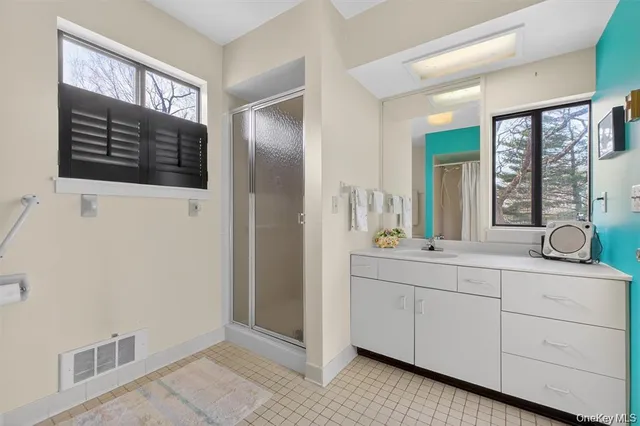 a bathroom with a sink a vanity and a mirror