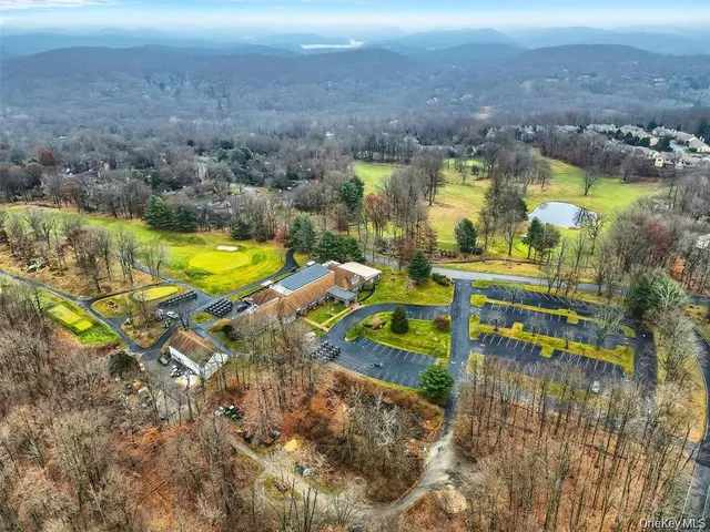 a sign broad in front of flowers