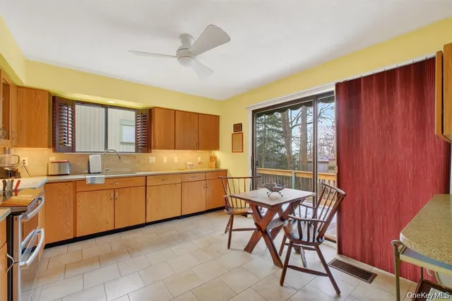 a kitchen with a table chairs and microwave