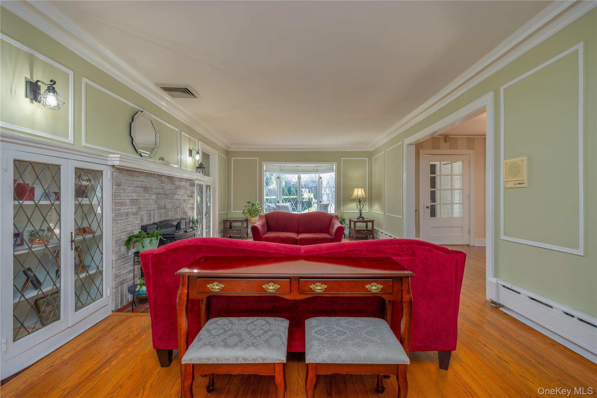 159 Fenimore Road New Rochelle, NY 10804 - Photo 6 of 37 Another view of the living room with built-ins and facing the charming window seat
