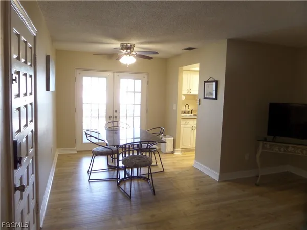 a view of a hallway with a dining room