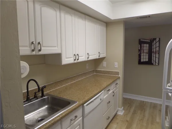 a kitchen that has a cabinets and a stove