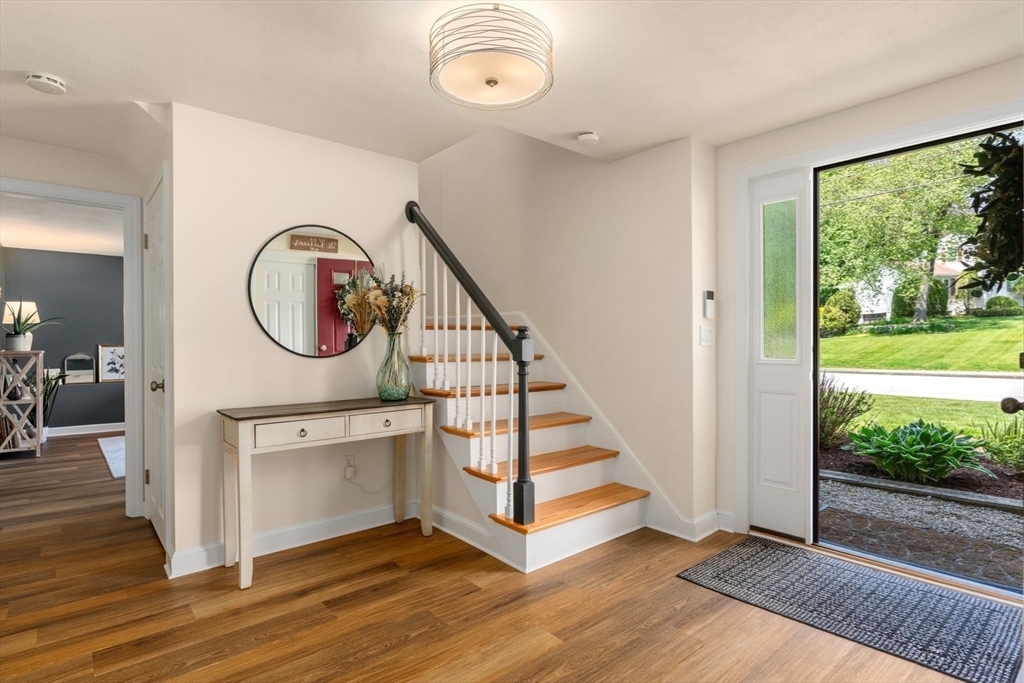 11 Longmeadow Road Medfield, MA 02052 - Photo 2 of 39 a view of a hallway with entryway wooden floor and front door