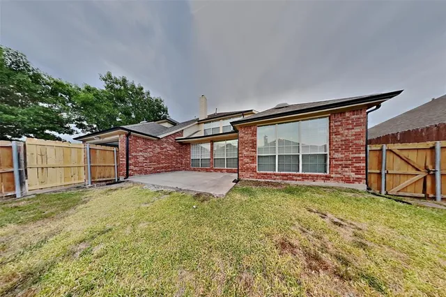 front view of a house with a big yard