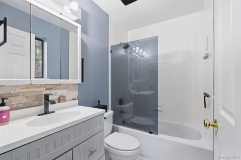 a living room with furniture and a rug