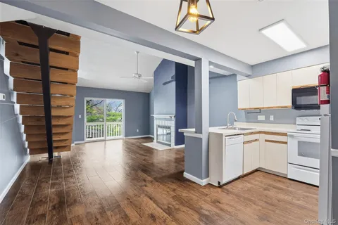 a kitchen with cabinets and white appliances
