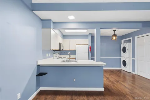 a view of livingroom with washer and dryer