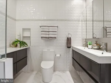 a view of a hallway with washer and dryer