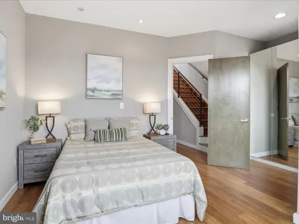 a bathroom with a sink a mirror and a shower