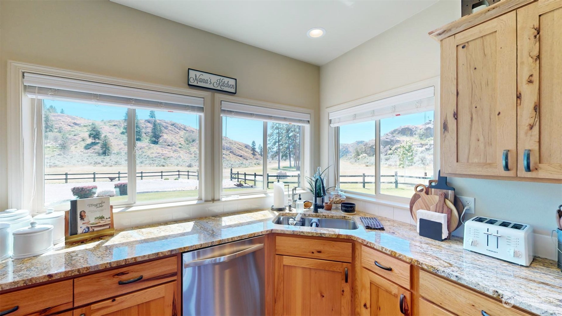 192 Hubbard Road Riverside, WA 98849 - Photo 11 of 40 a kitchen with granite countertop a sink and a window